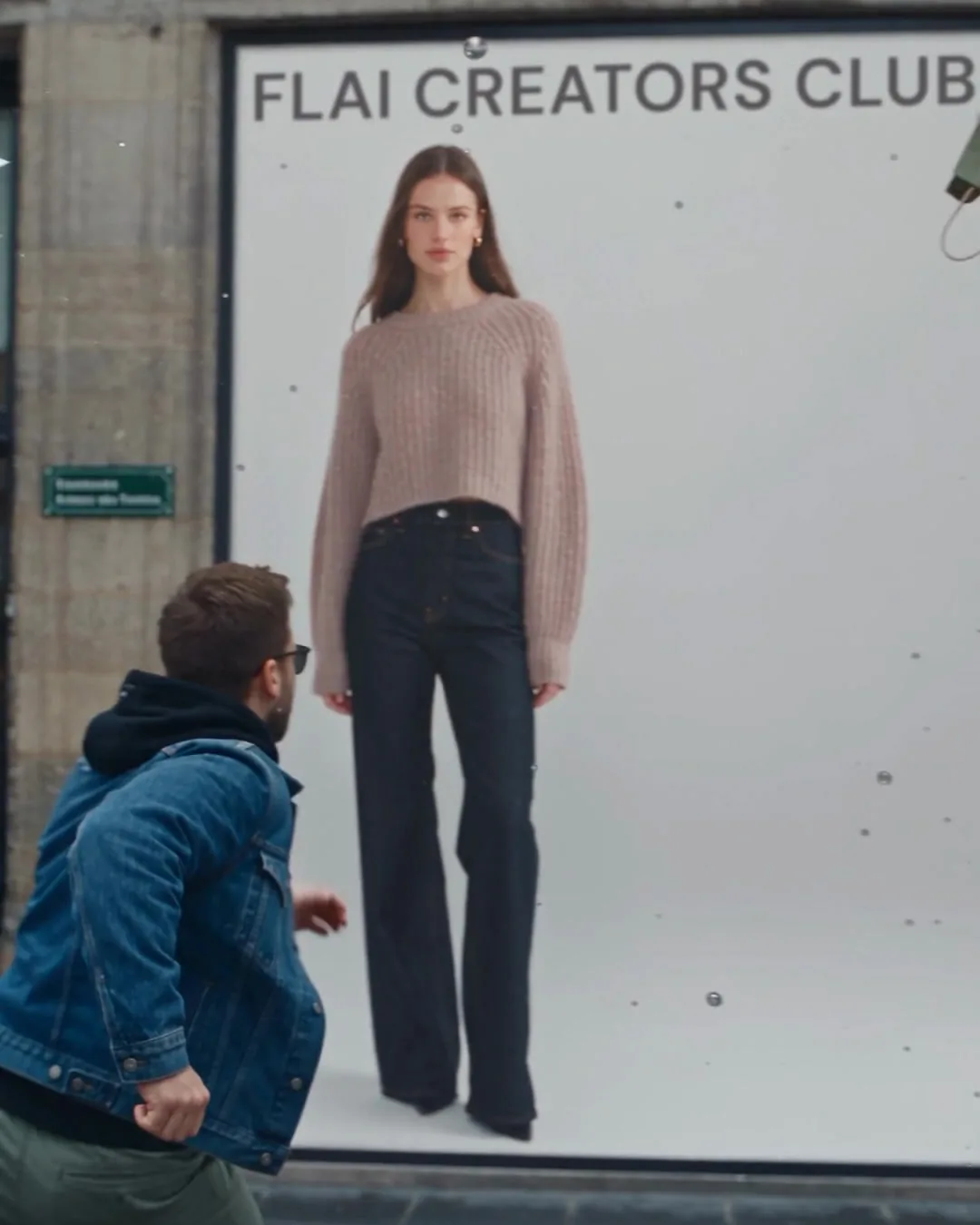 Still from an AI ad: a FLAI Creators Club billboard